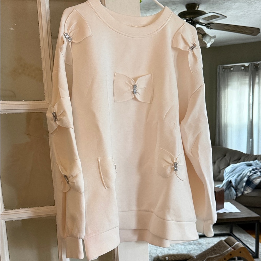 Anthropologie Cream Sweatshirt with Bow Accents